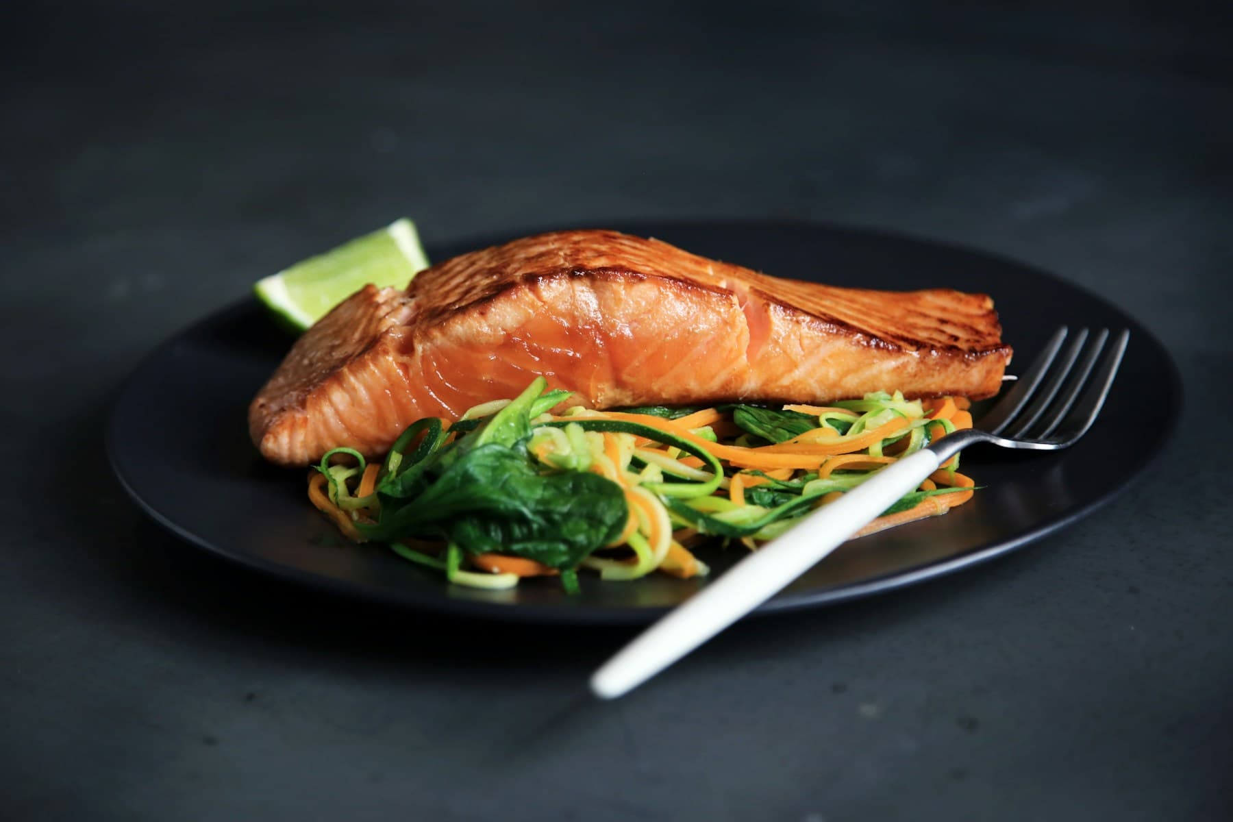 Grilled salmon served with vegetables
